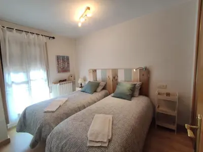 Cama o camas de una habitación en Inmocyma Cerler Prados de Velarta C 1-3