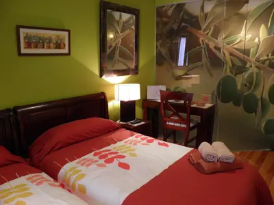 Cama o camas de una habitación en Hostal Rural Txapi Txuri Logis Hotels