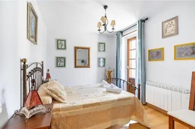 Cama o camas de una habitación en Apartamentos Búbal Peña Telera
