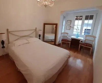 Cama o camas de una habitación en Acogedor piso en pleno centro de Zaragoza