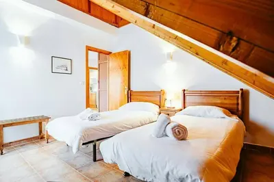 Cama o camas de una habitación en Olympia by Cardi Suites.