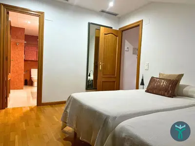 Cama o camas de una habitación en Dos Torres Ático Dúplex - Céntrico con Vistas a la Ciudad
