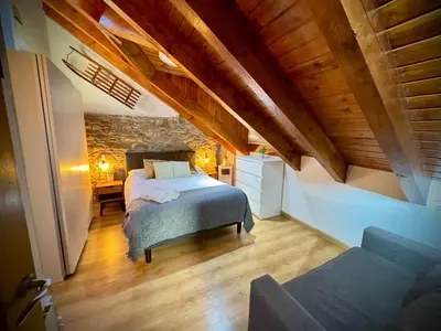 Cama o camas de una habitación en CAL DOMÈNEC RIALP - Dúplex con encanto - Se admiten mascotas