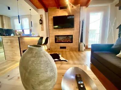 Una televisión o centro de entretenimiento en CAL DOMÈNEC RIALP - Dúplex con encanto - Se admiten mascotas