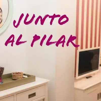 JUNTO AL PILAR