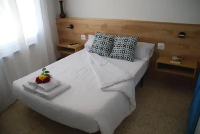 Cama o camas de una habitación en Cal Sabater, la teva llar lluny de casa