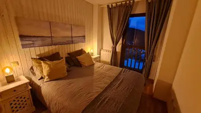 Cama o camas de una habitación en Tuhogarencerler parking y taquilla en pistas
