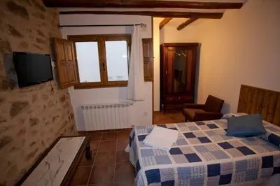 Cama o camas de una habitación en Casas Rural Calaceite