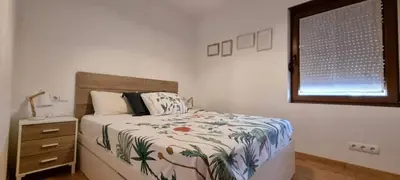 Cama o camas de una habitación en Casa con vistas, piscina y animales de granja, LA CASETA