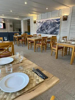 Un restaurante o sitio para comer en Baqueira321 Ubicación Privilegiada.