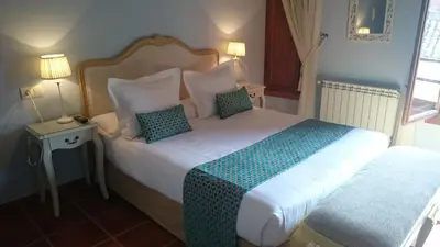 Cama o camas de una habitación en Casa Rural El Gaiter