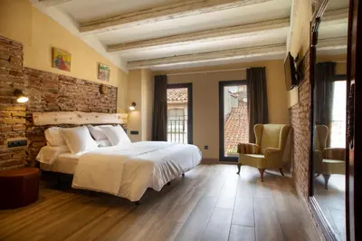 Cama o camas de una habitación en Priorat Aparthotel