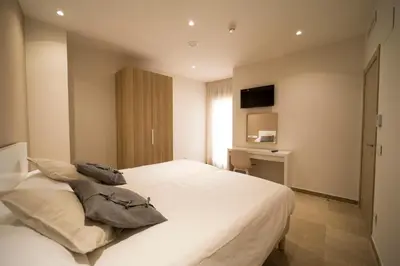 Cama o camas de una habitación en Hostal Martínez