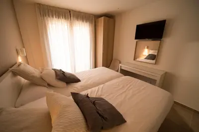 Cama o camas de una habitación en Hostal Martínez