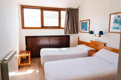 Cama o camas de una habitación en Apartamentos SNÖ Edelweiss