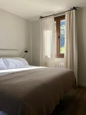 Cama o camas de una habitación en Les Nous Hotel