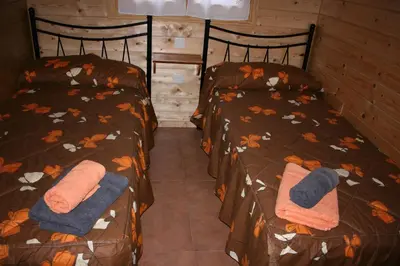 Cama o camas de una habitación en Bungalows Laspaúles