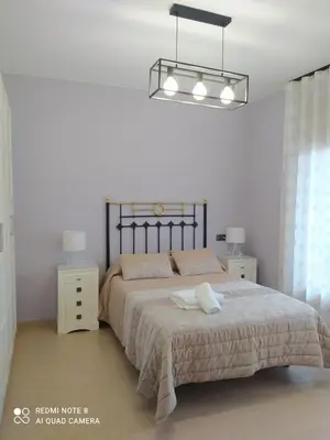 Cama o camas de una habitación en Vivienda El Olivo