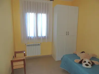 Cama o camas de una habitación en Vivienda El Olivo