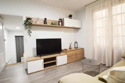 Una televisión o centro de entretenimiento en Apartamento Encanto Tarazona