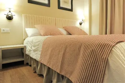 Cama o camas de una habitación en Chardín de Llis-Apartamentos Chardins