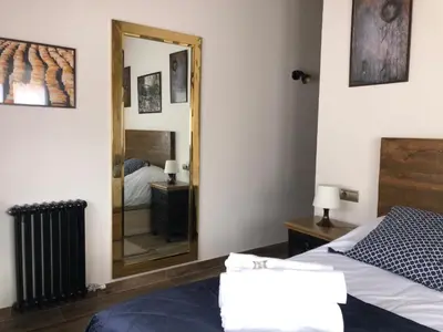 Cama o camas de una habitación en El Corral de Avelina