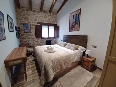 Cama o camas de una habitación en El Corral de Avelina