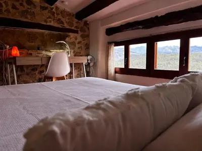 Cama o camas de una habitación en Rural Stone House with wood fireplace
