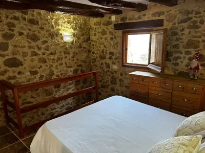 Cama o camas de una habitación en Rural Stone House with wood fireplace