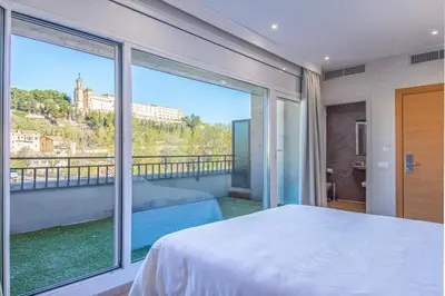 Cama o camas de una habitación en HOTEL JAUME D'URGELL