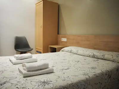 Cama o camas de una habitación en Pensión Acella
