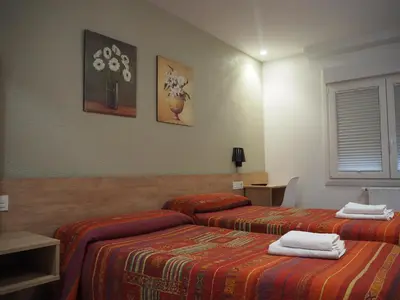 Cama o camas de una habitación en Pensión Acella