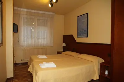 Cama o camas de una habitación en Pensión Acella