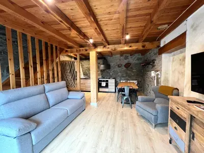 Una televisión o centro de entretenimiento en Casa Sinera - L'Amfitriona