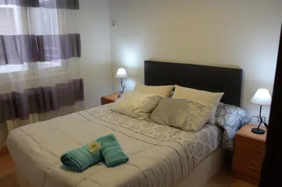Cama o camas de una habitación en El Refugio