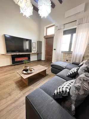 Una televisión o centro de entretenimiento en BÁNOVA APARTAMENTO TURÍSTICO