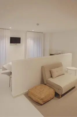 Una televisión o centro de entretenimiento en HOTEL LA FONDA B&B