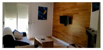 Una televisión o centro de entretenimiento en Apartamento Holidays in Ainsa