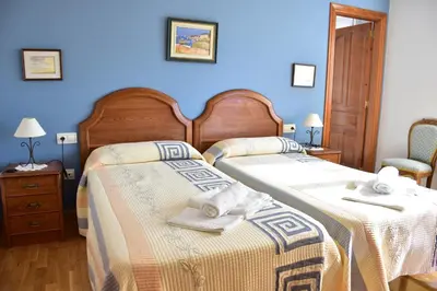 Cama o camas de una habitación en Casa Raichu - Pilgrim Guesthouse