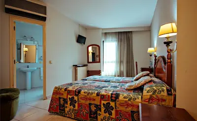 Cama o camas de una habitación en Hotel BONCOMPTE