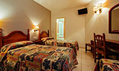 Cama o camas de una habitación en Hotel BONCOMPTE