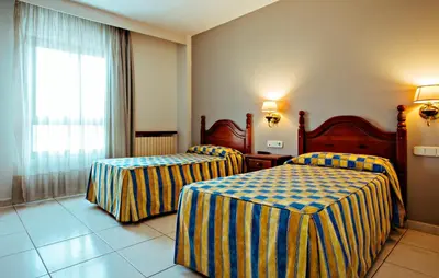 Cama o camas de una habitación en Hotel BONCOMPTE