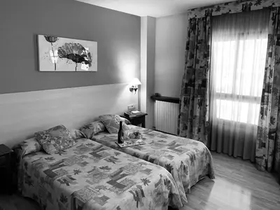 Cama o camas de una habitación en Hotel BONCOMPTE