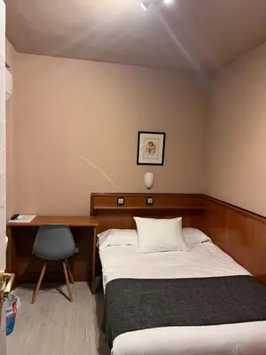 Cama o camas de una habitación en Hostal Arenal