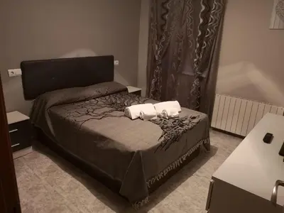 Cama o camas de una habitación en Apartamento Duartes en Barbastro vistas al pirineo