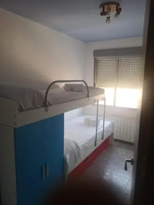 Cama o camas de una habitación en Apartamento Duartes en Barbastro vistas al pirineo