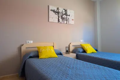 Cama o camas de una habitación en MEQUEDO AVENIDA ZARAGOZA