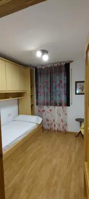 Cama o camas de una habitación en Apartamento Vicente, bonito apartamento en Boltaña