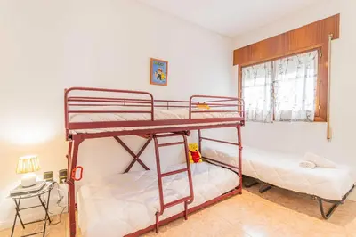 Cama o camas de una habitación en Amplio apartamento junto a la Basílica del Pilar by CABANA Rentals