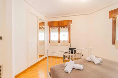 Cama o camas de una habitación en Amplio apartamento junto a la Basílica del Pilar by CABANA Rentals